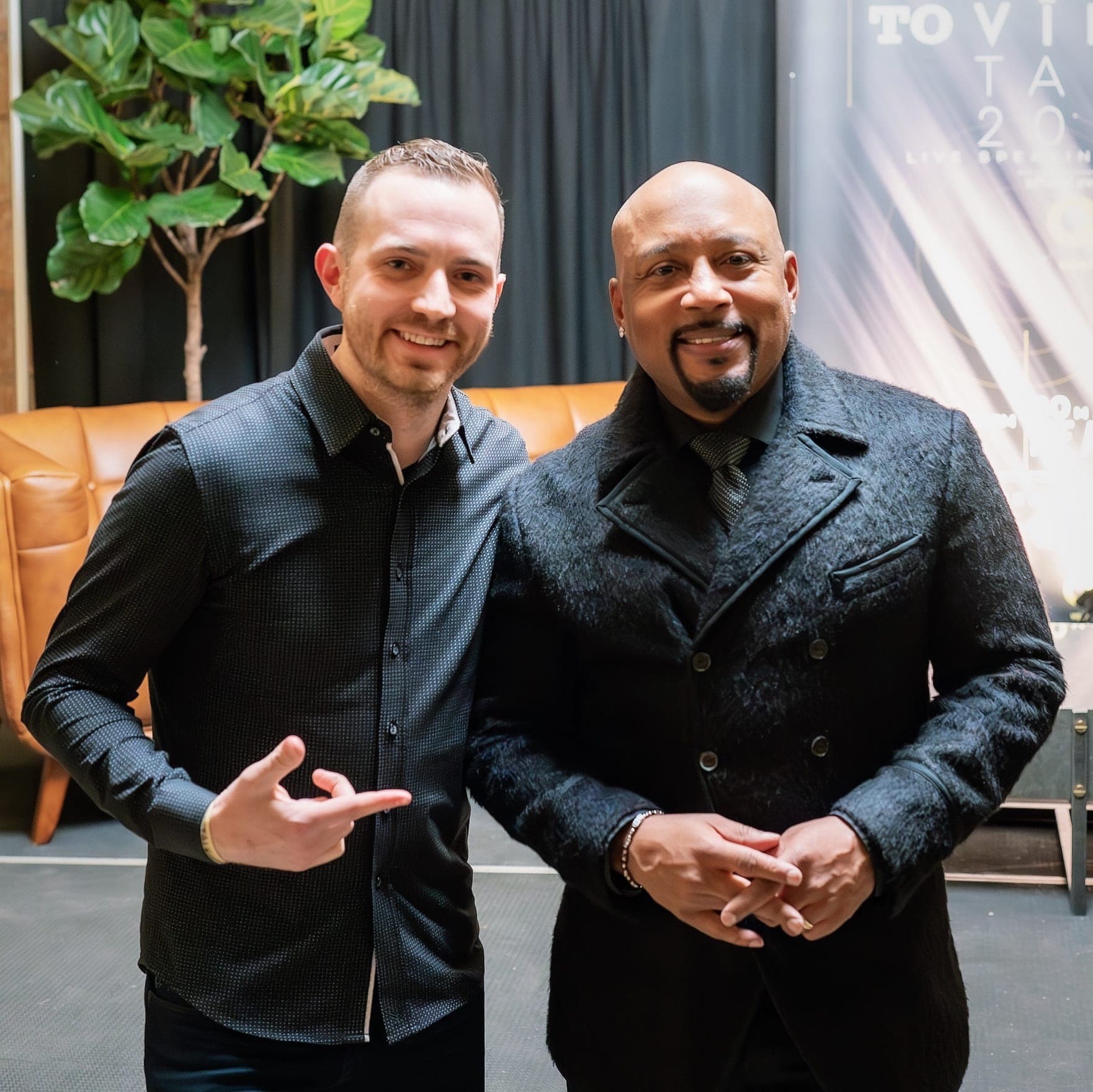 Chris Dare backstage with Shark Tank investor Daymond John at a live speaking event